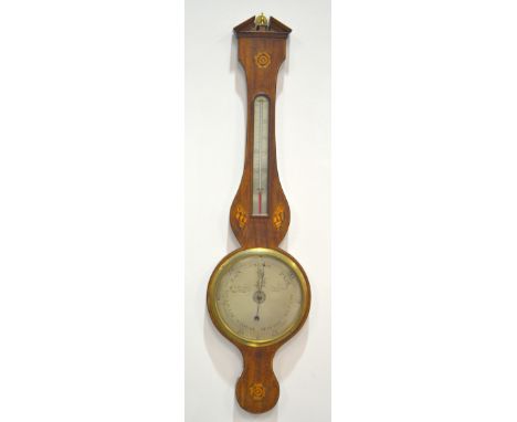 A George III mahogany wheel barometer inlaid with shell paterae incorporating a thermometer, the silvered dial engraved P Cat