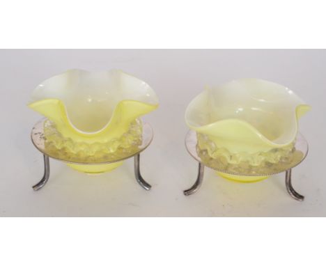 A pair of late 19th Century Stourbridge glass table salts of circular form with quatrelobed rim, cased in yellow over opal wi