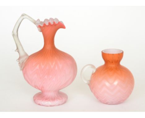 A late 19th Century Stourbridge quilted air trap satin glass ewer of footed compressed ovoid form with collar neck, frill rim