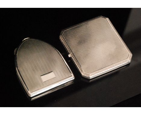 A hallmarked silver cigarette case designed as a purse with engine turned decoration within a foliate border, of square form 