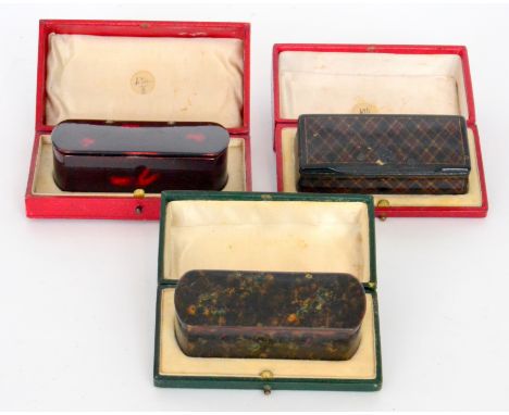 Three late 19th to early 20th Century papier mache snuff boxes to include a tartan style box, width 10cm, A/F, a tortoiseshel