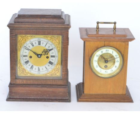 A 20th Century oak cased mantle clock with silvered dial and brass corner spandrels together with a similar mantle clock in l