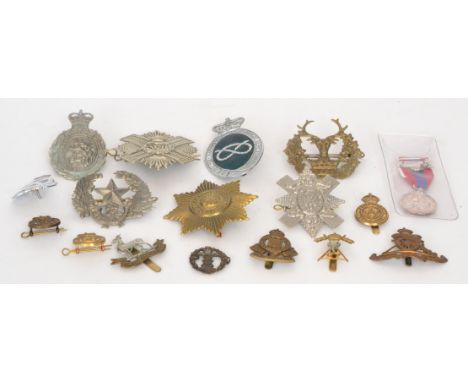 A collection of twenty eight army cap badges to include King's Own Malta regiment, Cameron Highlanders, 21 SAS, Shropshire Ye