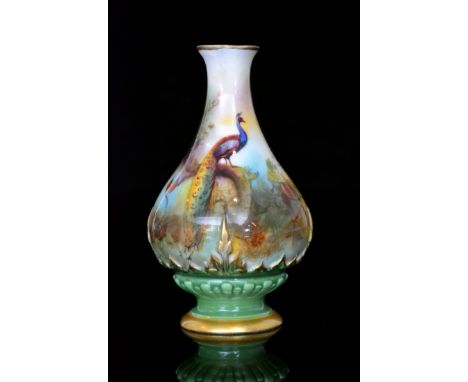 An early 20th Century Royal Worcester Hadley's shape 285 bud vase decorated a peacock perched upon a pine branch, in the styl