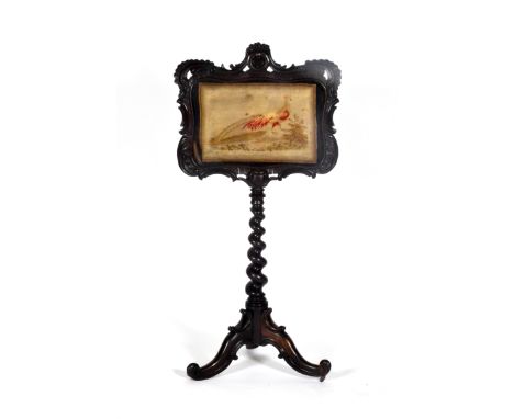 A Victorian mahogany pole screen with foliate-carved cartouche-shaped panel above a barley twist support and tripod base, hei