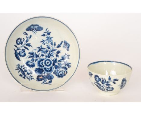 A late 18th Century 'First Period' Worcester teabowl and saucer decorated in the transfer applied blue and white Three Flower