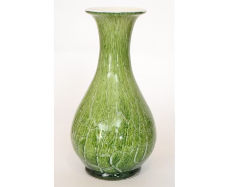 A contemporary studio glass vase cased in clear crystal over a marbled and fissured tonal green ground with opal core, unmark