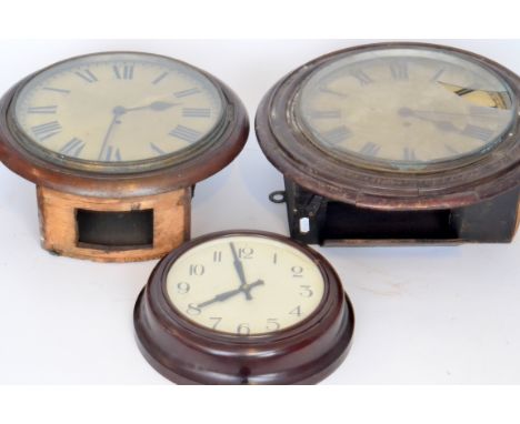 Two early 20th Century mahogany circular wall clocks each with single fusee movement and a circular brown Bakelite wall clock
