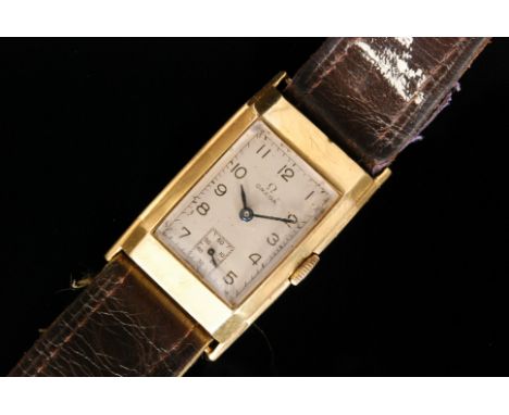 A late 1930s 18ct gentleman's Omega wristwatch, the rectangular champagne dial with Arabic numerals and subsidiary seconds di