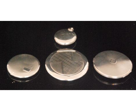 Four hallmarked silver circular powder compacts of various sizes, three with engine turned design and one centred with the in