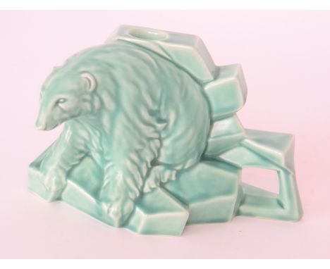 A 1930s Art Deco Royal Jade candlestick modelled as a polar bear stood upon ice blocks, printed marks, height 10cm