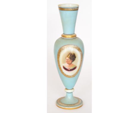 A large late 19th Century Continental opaline glass vase of slender footed, baluster form with a flared collar neck, enamel d