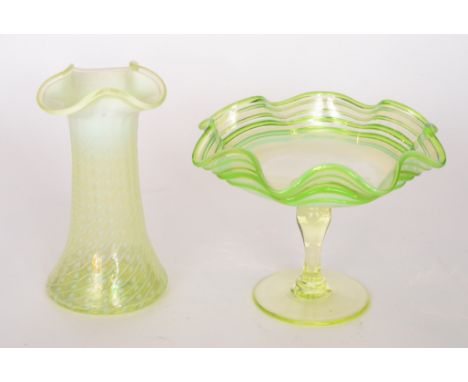 A late 19th Century Stourbridge glass tazza with a shallow wave rim bowl decorated with applied green threading over the grad