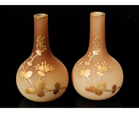 A pair of late 19th Century Thomas Webb & Sons posy vases of globe and shaft form, relief gilt paste decorated with stylised 