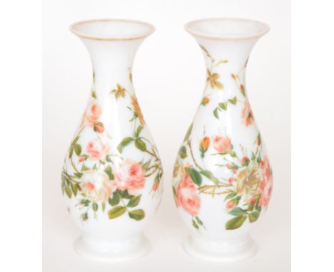 A pair of late 19th Century Continental glass vases of footed baluster form with flared neck, enamel decorated with flowering