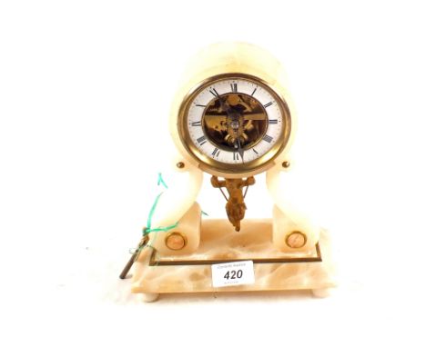 An alabaster mantel clock with unusual child on a swing forward and backward action pendulum (case repair)