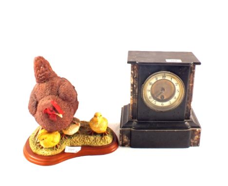 A black slate mantel clock plus a Border Fine Arts hen and chicks