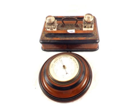 A Victorian ebonised two bottle inkstand and a circular aneroid barometer