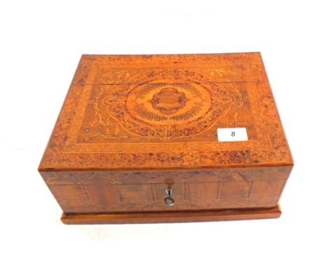 A good quality jewellery box profusely inlaid in various woods with leaf, floral and architectural designs, label to interior