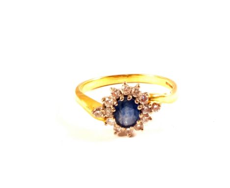 An 18ct Gold Sapphire and Diamond cluster ring, size R