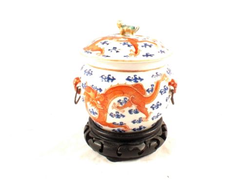A 19th Century Chinese lidded pot with dragon chasing flaming pearl decoration, height 5"