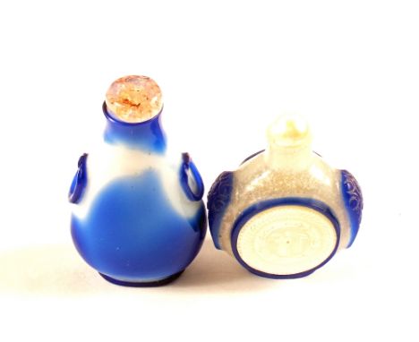 Two Chinese blue overlaid glass snuff bottles, one with Rose Quartz stopper, the other with Mother of Pearl panels and stoppe