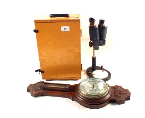 A cased binocular microscope and an Oak barometer