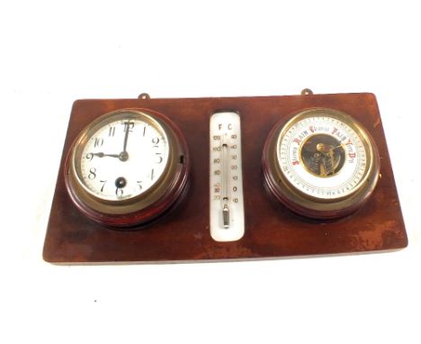 A 1960's Sputnik weather station marked BGM, a mounted clock, barometer and thermometer set