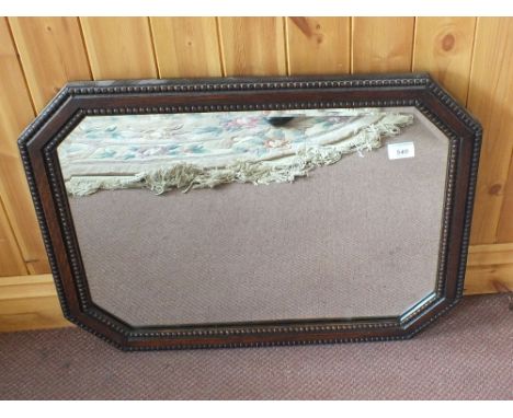 An Oak wall mirror, ship style clock, a barometer and a box of books