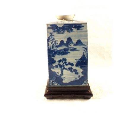 A large 18th Century Chinese blue and white tea caddy with pagoda, landscape and figure decoration (top rim losses), height 1