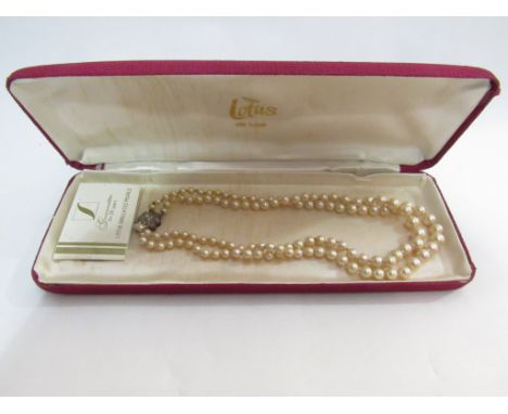 A cased Lotus vintage two row pearl necklace with silver and marcasite feature clasp