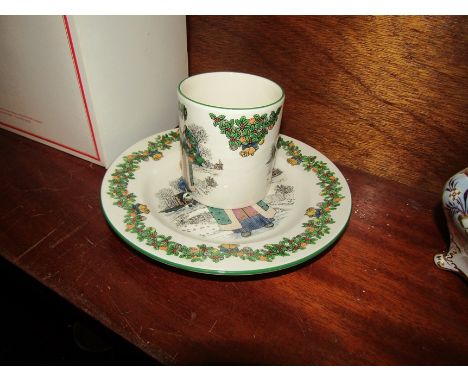 A boxed Spode Christmas plate and mug. "Santas Around the World. British Santa Claus" first in a series
