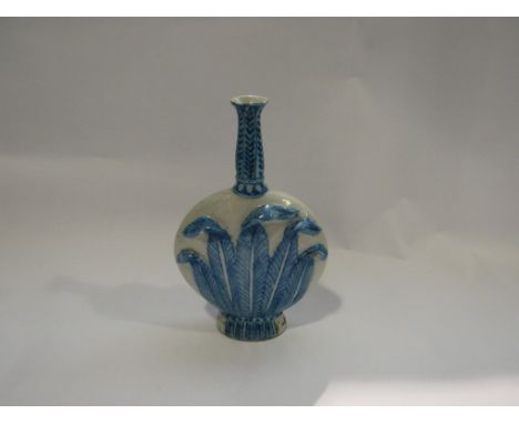 A porcelain moon flask with leaf decoration, a/f chips to rim and body along with firing crack, 23.5cm tall