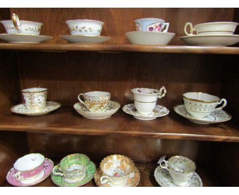 Four late 18th/early 19th Century cabinet cups and saucers, white ground with gilt floral detailing including example with bi