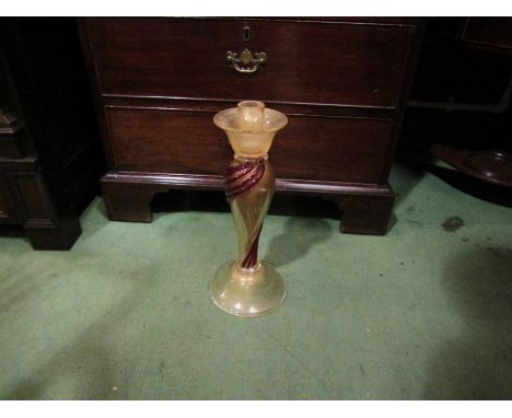 A Venetian style glass candlestick with red glass swirl decoration, 36cm tall