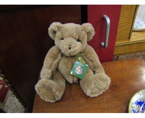 A vintage Harrods Teddy bear with original label and Harrods bow