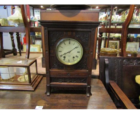 A J.W.Benson of London walnut cased mantel clock with 8-day movement, Roman numerated dial, carved foliate and floral case, 4