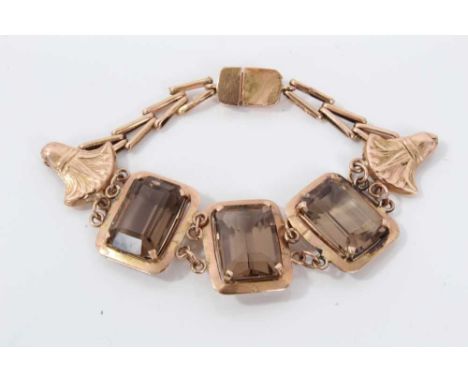 Egyptian revival gold and smoky quartz bracelet with three rectangular step cut smoky quartz stones in gold setting, tests as