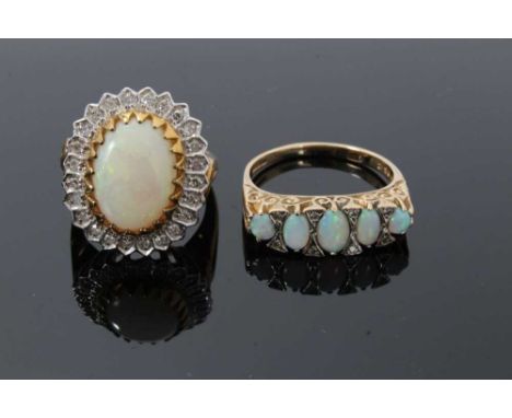 Two 9ct gold and diamond dress rings, one with an oval opal cabochon measuring approximately 13.5mm x 9.7mm surrounded by a b