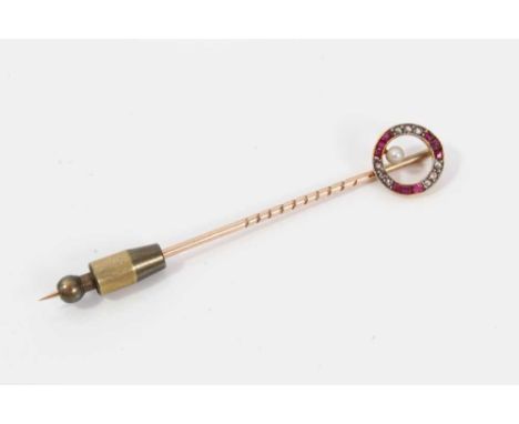 Edwardian diamond, ruby and pearl stick pin, the circle with calibre cut rubies and rose cut diamonds and a single pearl. Cir