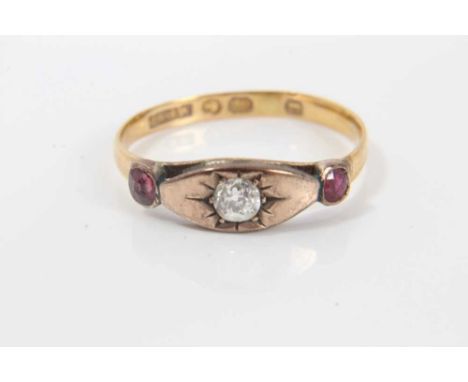 Victorian diamond and ruby three stone ring with a central old cut diamond in gypsy-style setting flanked by two rubies in 9c