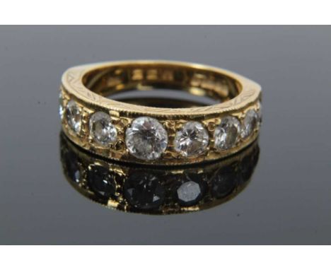 Diamond nine stone ring with a half hoop of nine graduated round brilliant cut diamonds in grain setting with engraved sides 