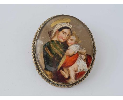 A portrait brooch of a lady with child 