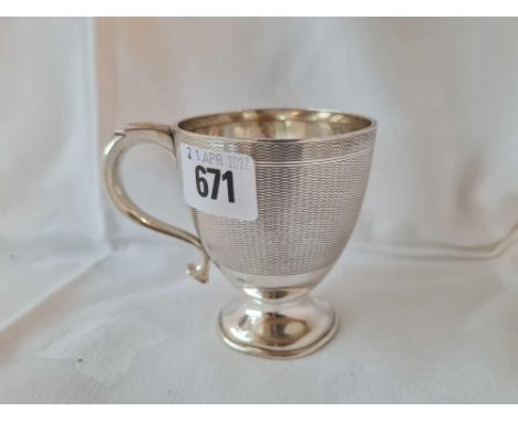 A christening cup with engine turned decoration - 3.5" high - Birmingham 1937 - 115 g.