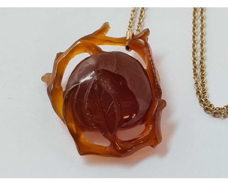 An oriental carved jade pendant of a peach 3cm wide on 9ct gold chain 9.2g inc