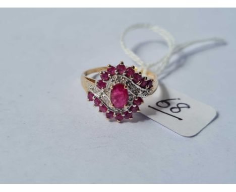 A ruby and diamond cluster ring in 9ct size T 3.5g inc
