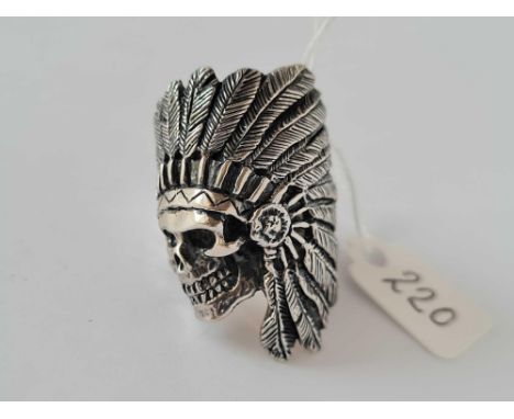 A heavy gents silver ring of a skull with red Indian head dress 