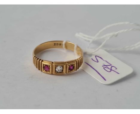 A three stone ruby and diamond ring 18ct gold size O - 2.9 gms 