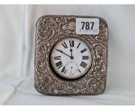Gun metal cased travelling clock with silver mounted case