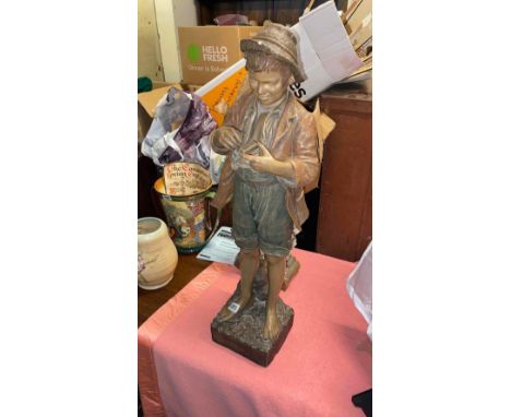 A German Goldscheider of a boy with a snuff box - 30" high 